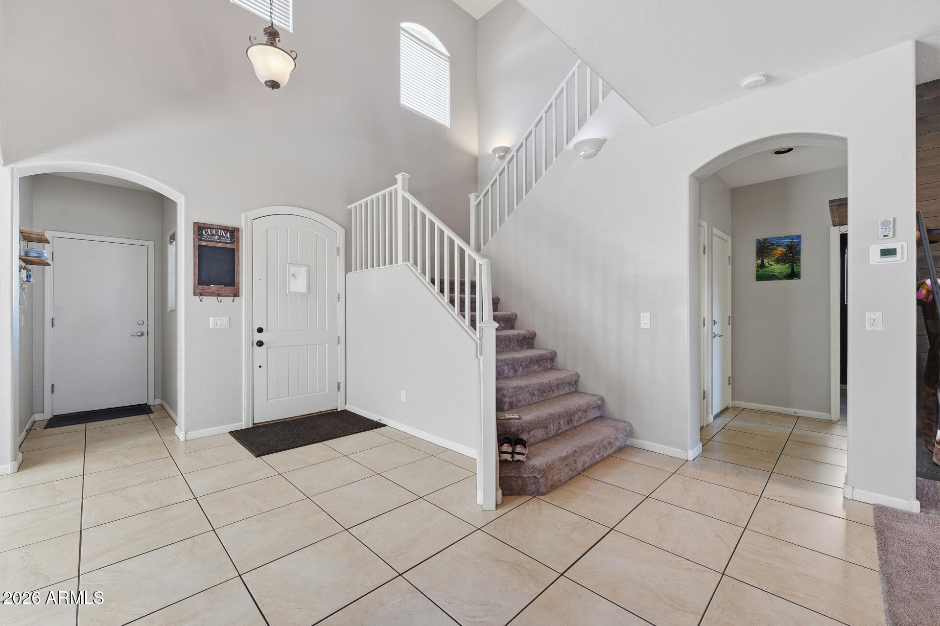 3273 East Fairview Street Gilbert, AZ 85295 - Photo 4 of 37 a view of an entryway with stairs