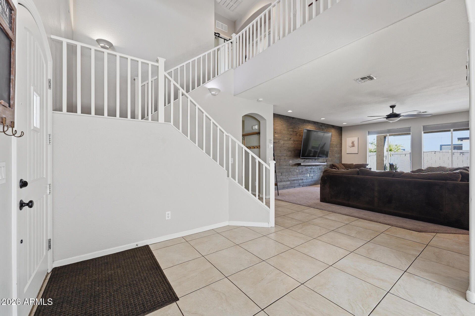 3273 East Fairview Street Gilbert, AZ 85295 - Photo 5 of 37 a view of entryway and hall with wooden floor