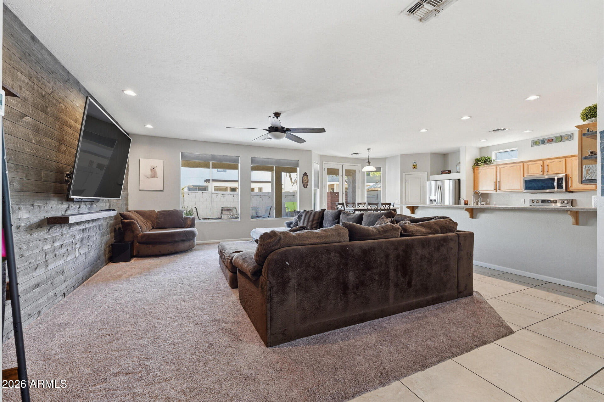 3273 East Fairview Street Gilbert, AZ 85295 - Photo 9 of 37 a living room with furniture and a flat screen tv
