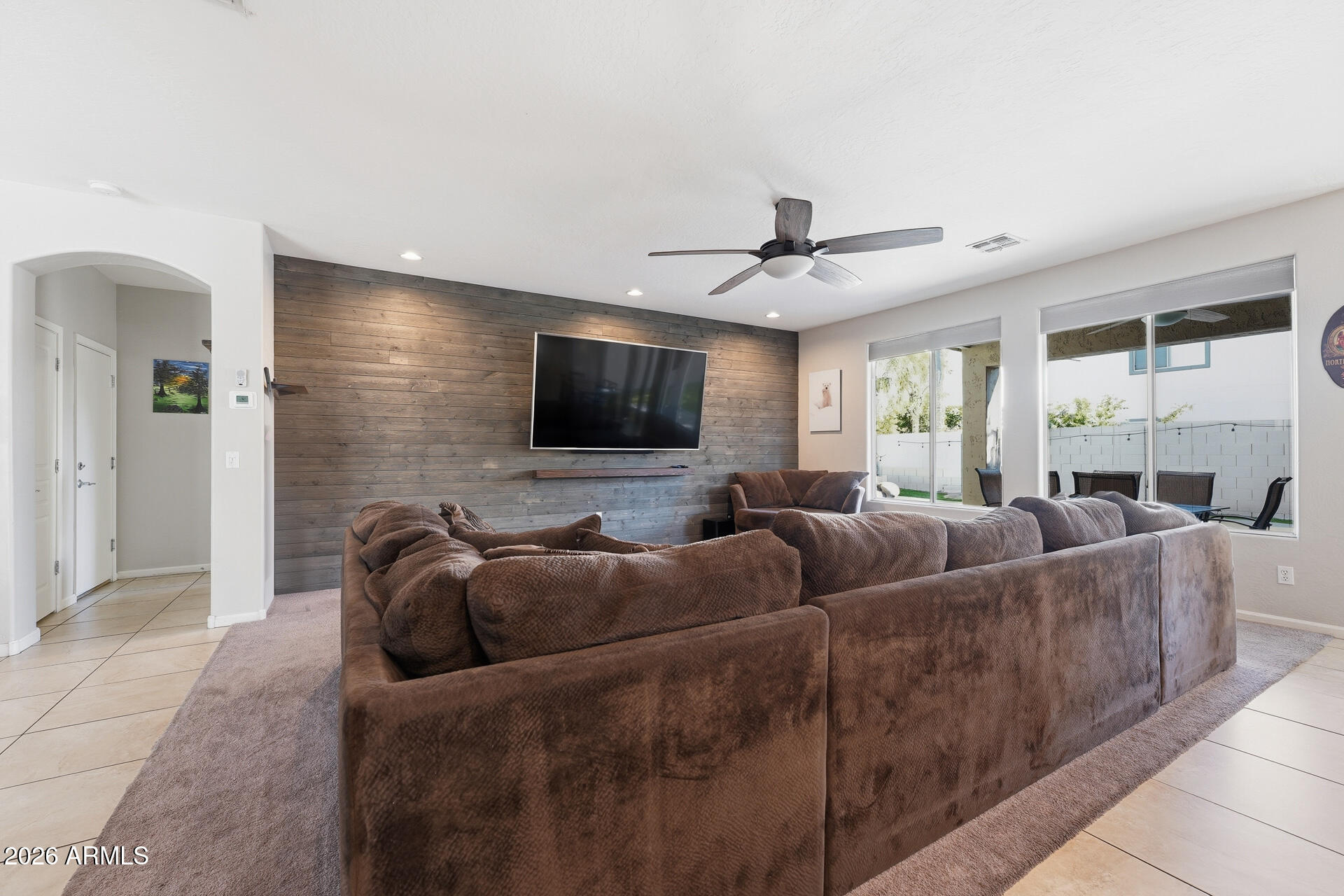 3273 East Fairview Street Gilbert, AZ 85295 - Photo 10 of 37 a living room with furniture and a flat screen tv