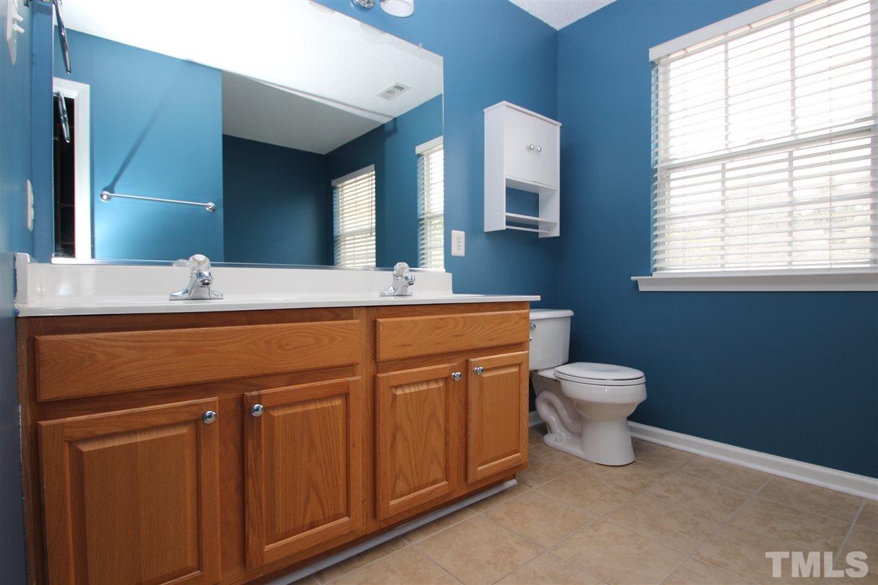 5312 Arete Way Raleigh, NC 27607 - Photo 12 of 20 a bathroom with a sink toilet and mirror