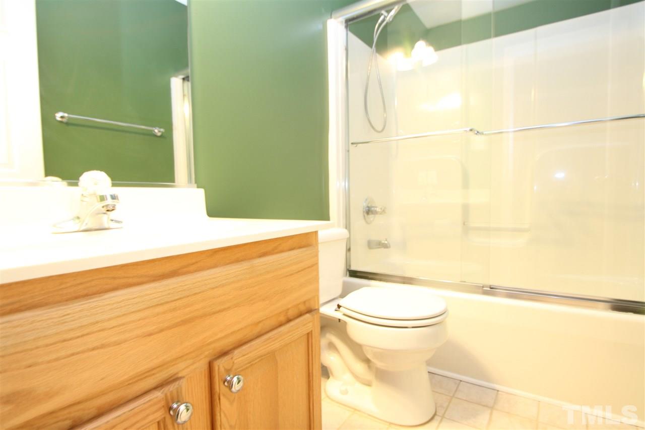 5312 Arete Way Raleigh, NC 27607 - Photo 16 of 20 a bathroom with a sink and a mirror