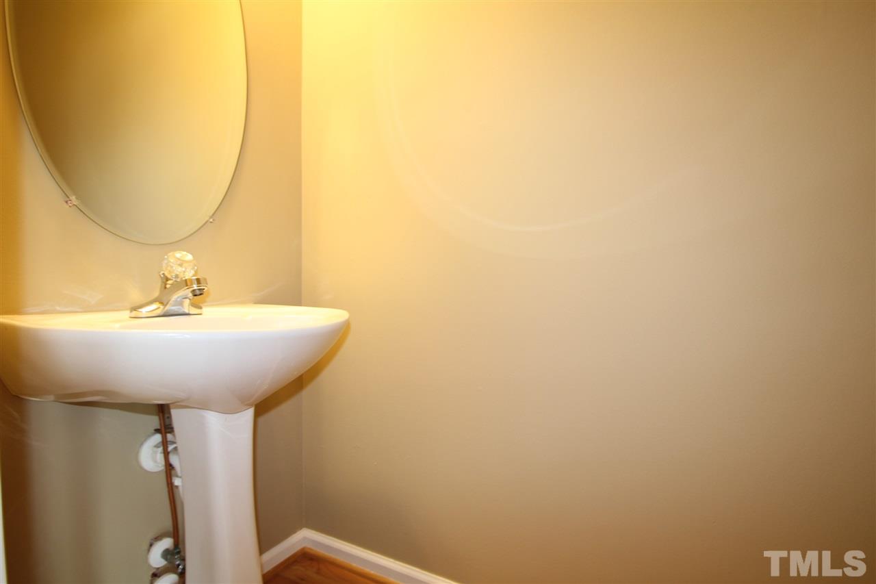 5312 Arete Way Raleigh, NC 27607 - Photo 18 of 20 a bathroom with a sink and a mirror