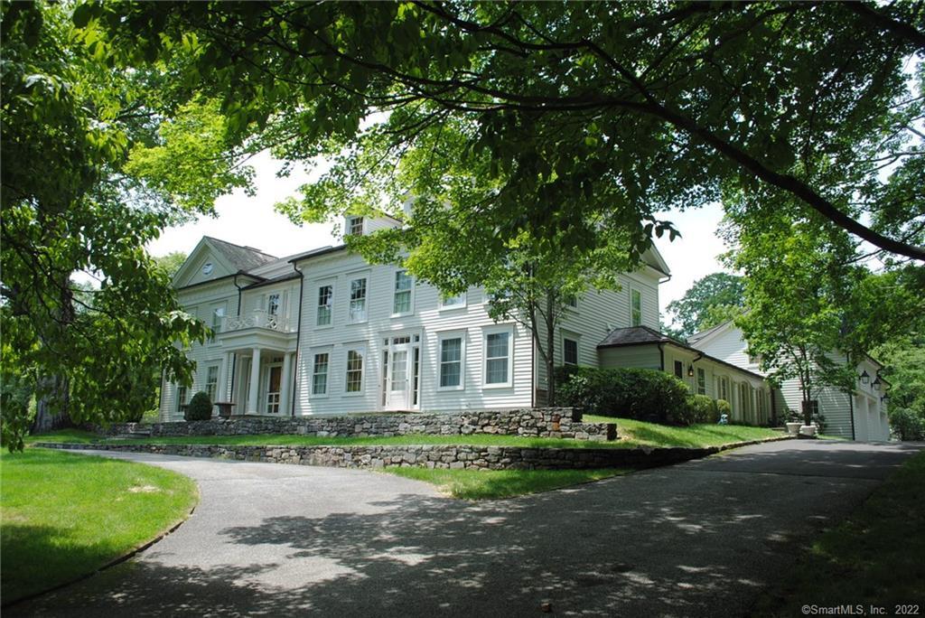 546 Old Academy Road Fairfield, CT 06824 - Photo 1 of 1 a front view of a house with a garden