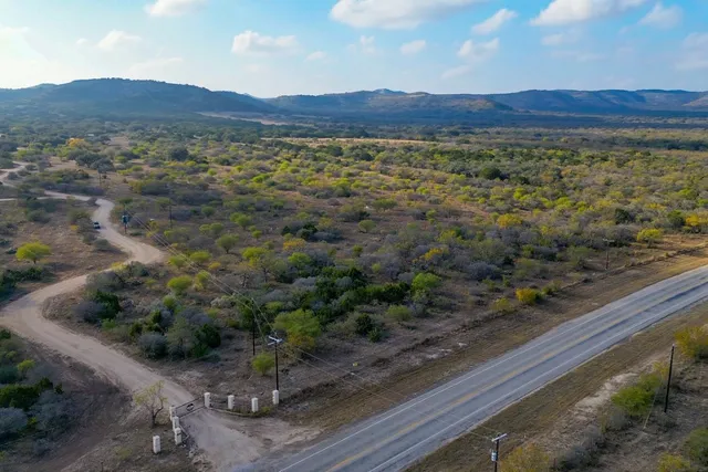 a view of a field with an ocean