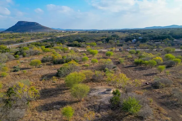 a view of a lake with houses in the back
