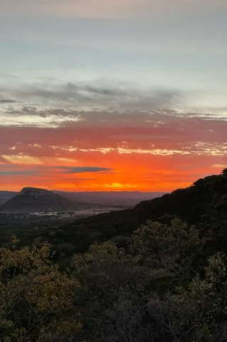 a view of an ocean and mountain
