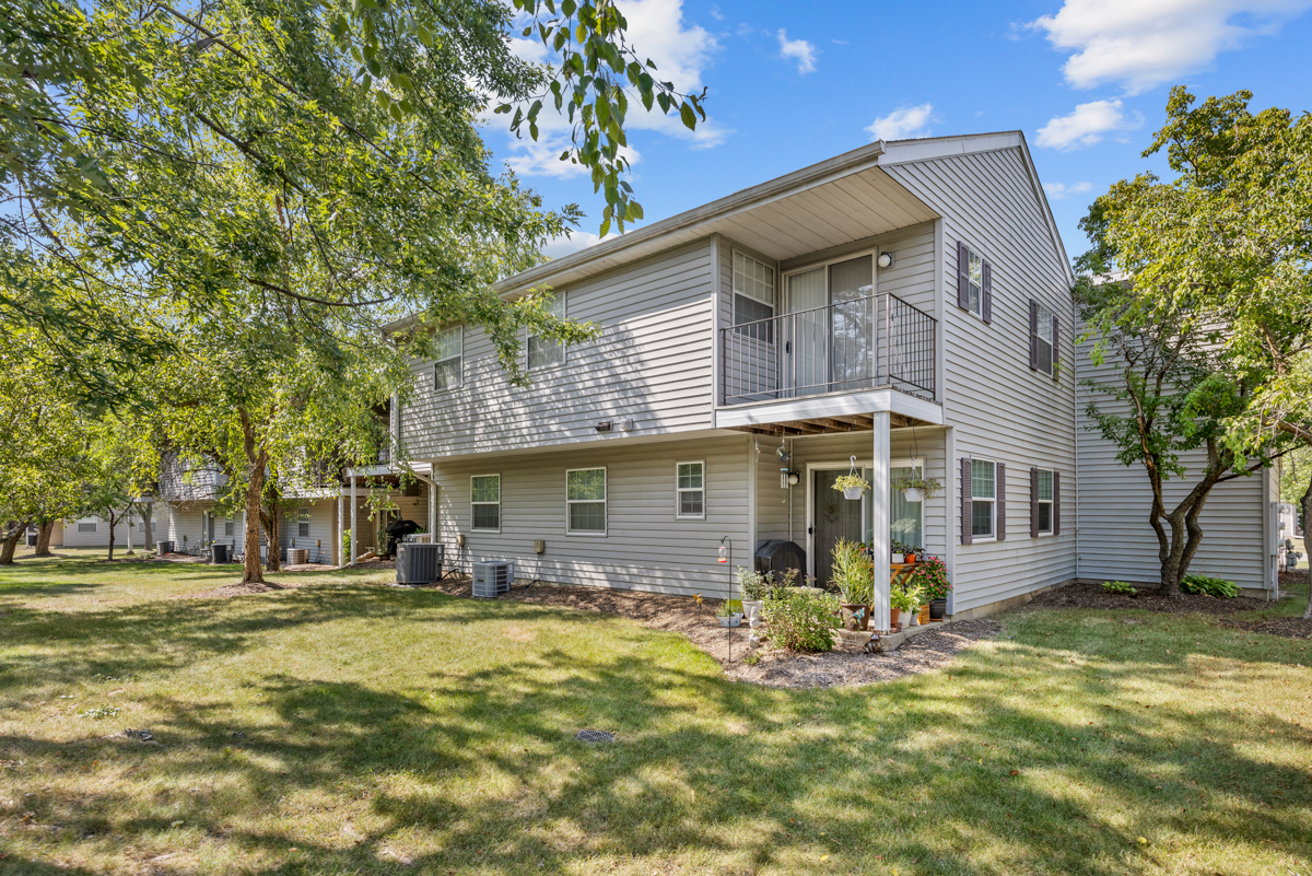 47 Gant Circle, Unit E Streamwood, IL 60107 - Photo 17 of 21 a view of a house with a yard