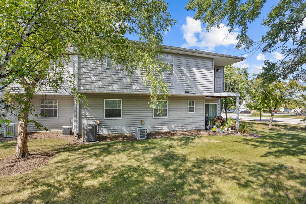 47 Gant Circle, Unit E Streamwood, IL 60107 - Photo 18 of 21 a front view of house with yard