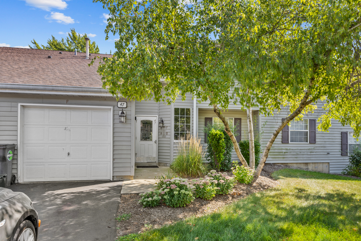 47 Gant Circle, Unit E Streamwood, IL 60107 - Photo 19 of 21 front view of a house with a yard