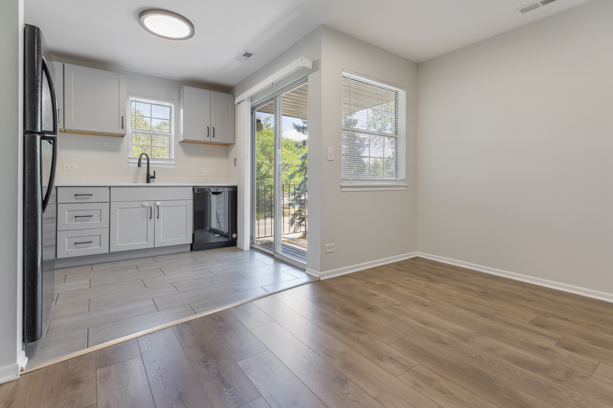 47 Gant Circle, Unit E Streamwood, IL 60107 - Photo 4 of 21 wooden floor in an empty room with a window