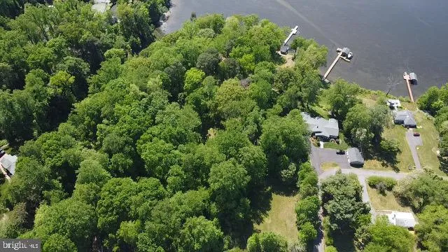 an aerial view of a house with a yard and outdoor space