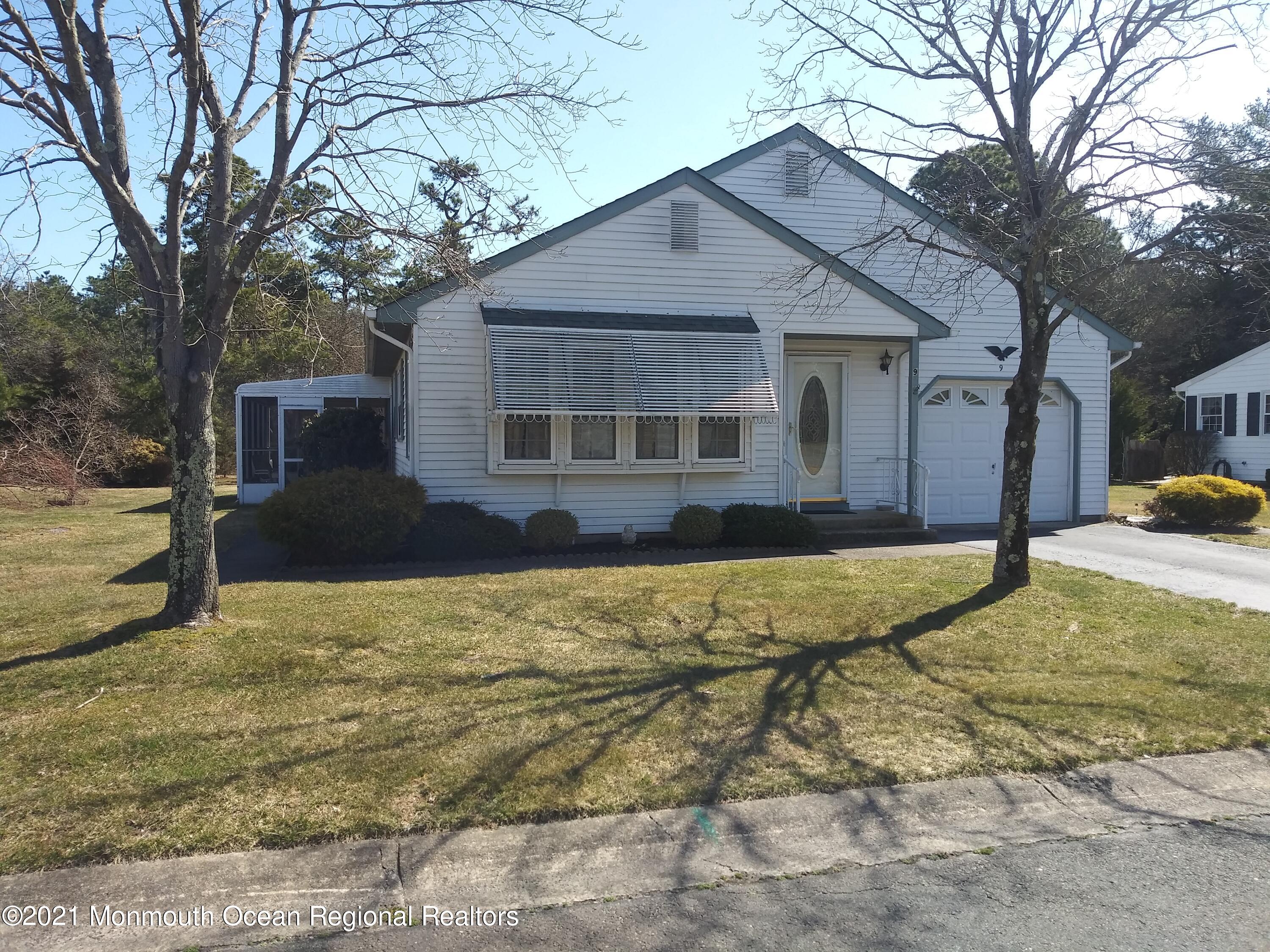 9 Ashley Road, Unit 63 Whiting, NJ 08759 - Photo 2 of 11 a view of a house with snow on the wall