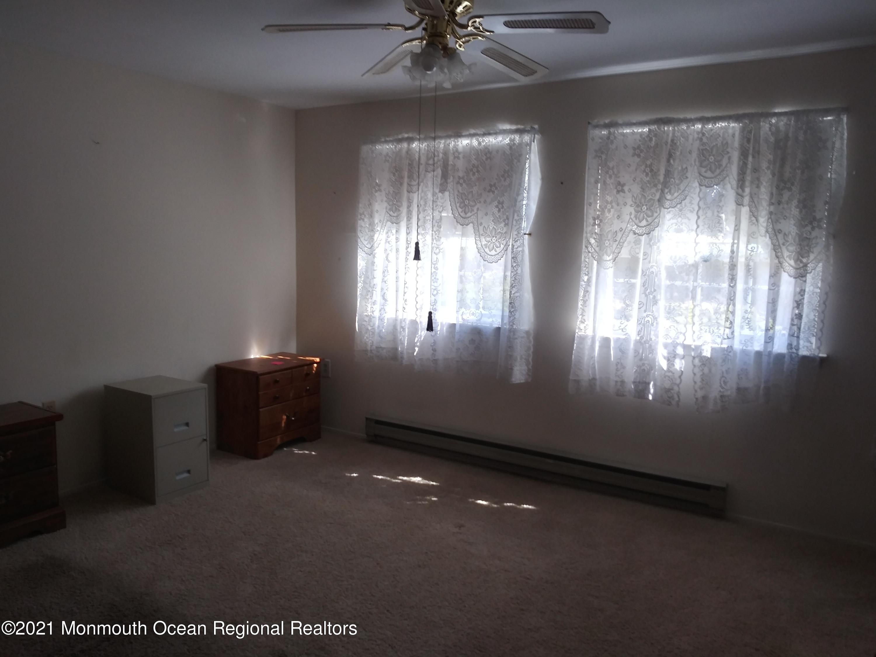 9 Ashley Road, Unit 63 Whiting, NJ 08759 - Photo 9 of 11 a view of an empty room and window