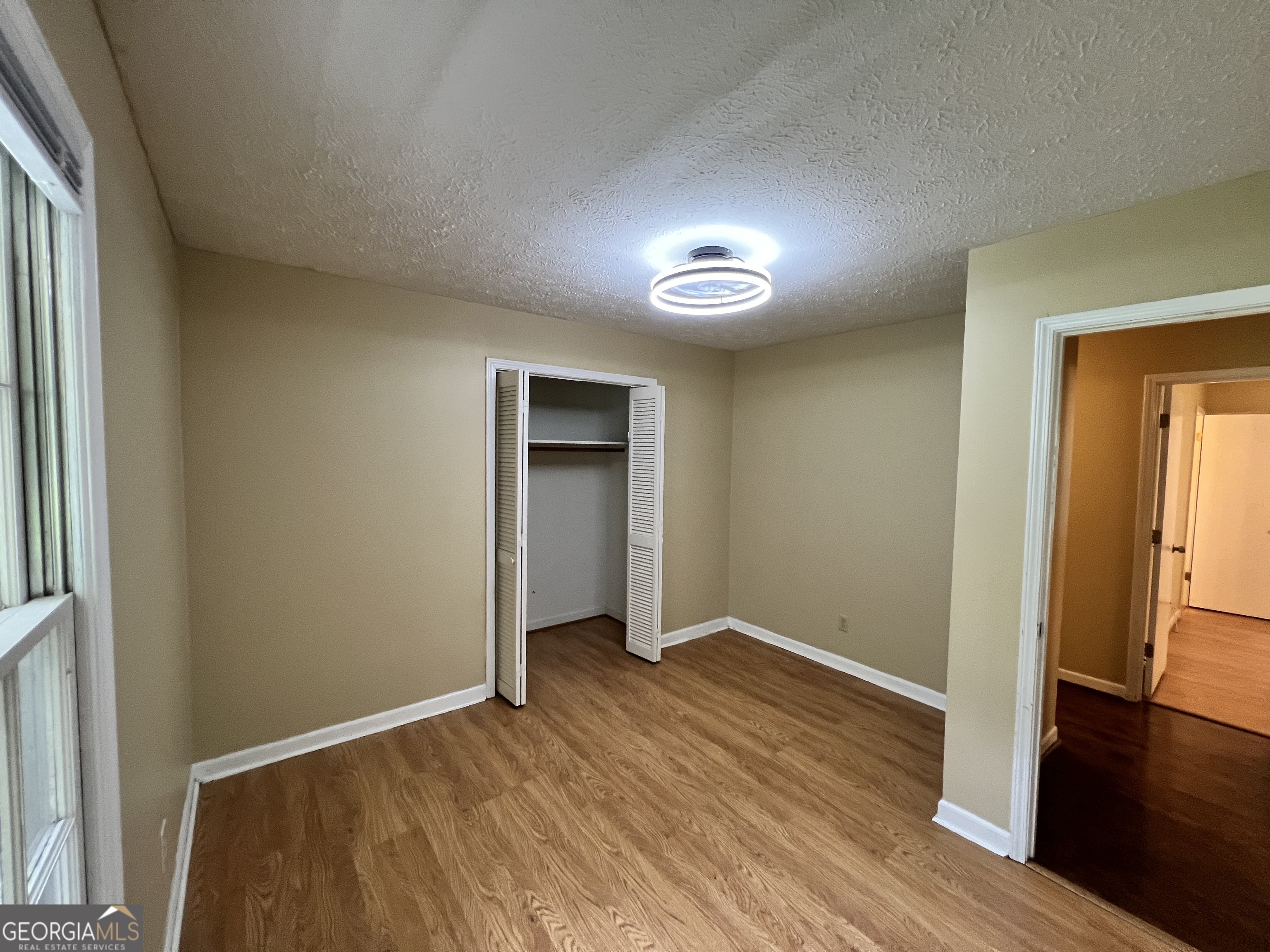 32 Ford Drive Southeast Rome, GA 30161 - Photo 22 of 49 an empty room with wooden floor and windows