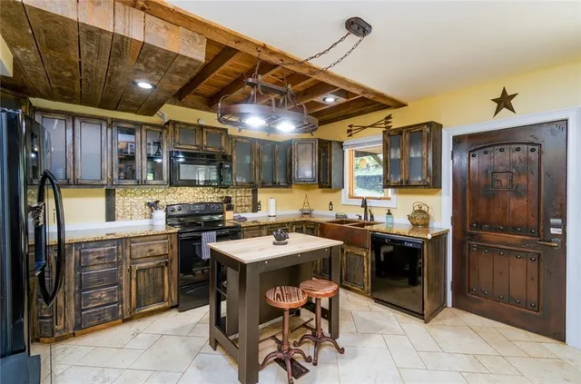 a kitchen with cabinets a sink and appliances