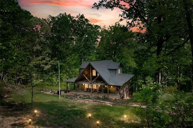 a house with trees in the background