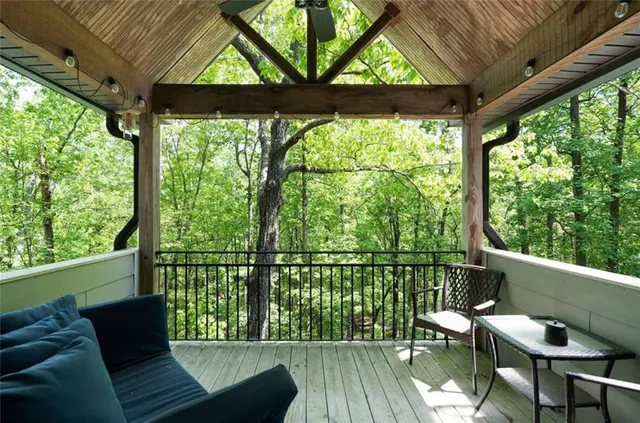 a view of a chair and table in the balcony