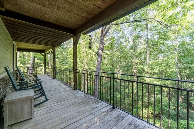 a view of a balcony with wooden floor