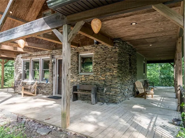 a view of a patio with table and chairs and potted plants