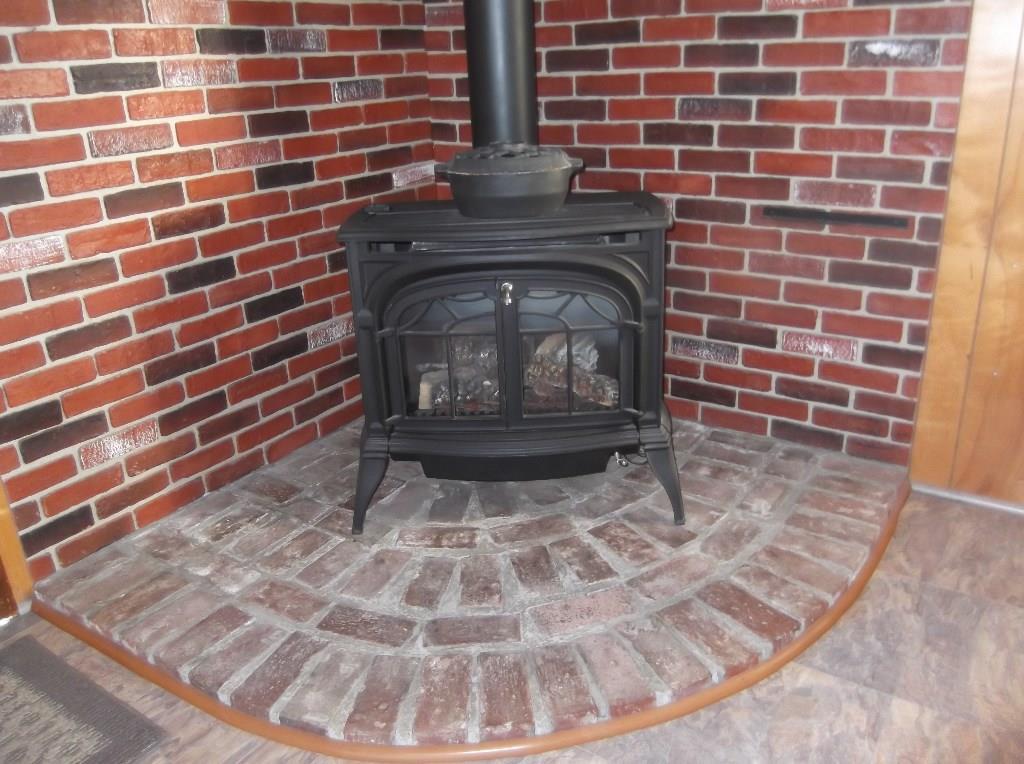 1235 Dexter Road Dover-Foxcroft, ME 04426 - Photo 3 of 26 Vermont Casing gas stove on brick...
