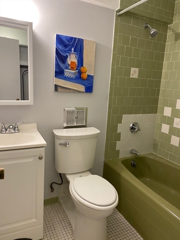 4 Trowbridge Place, Unit 3B Cambridge, MA 02138 - Photo 11 of 11 a bathroom with a sink a toilet and bathtub