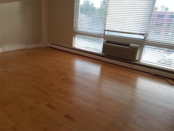 4 Trowbridge Place, Unit 3B Cambridge, MA 02138 - Photo 8 of 11 a view of a room with wooden floor and a window