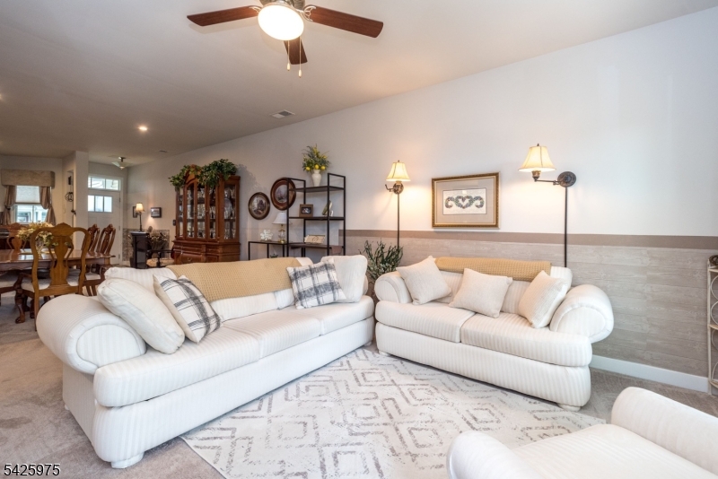 2 Sharp Shinned Court Washington, NJ 07882 - Photo 17 of 27 a living room with furniture and a chandelier
