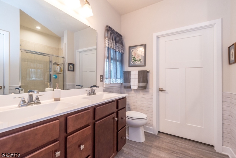 2 Sharp Shinned Court Washington, NJ 07882 - Photo 20 of 27 a bathroom with a double vanity sink toilet and shower