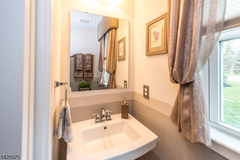 2 Sharp Shinned Court Washington, NJ 07882 - Photo 22 of 27 a bathroom with a sink and a mirror