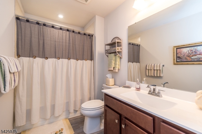 2 Sharp Shinned Court Washington, NJ 07882 - Photo 27 of 27 a bathroom with a sink a toilet and a mirror