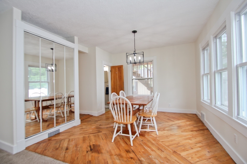 38 Virginia Street Springfield, MA 01108 - Photo 8 of 42 a view of a dining room with furniture window and wooden floor
