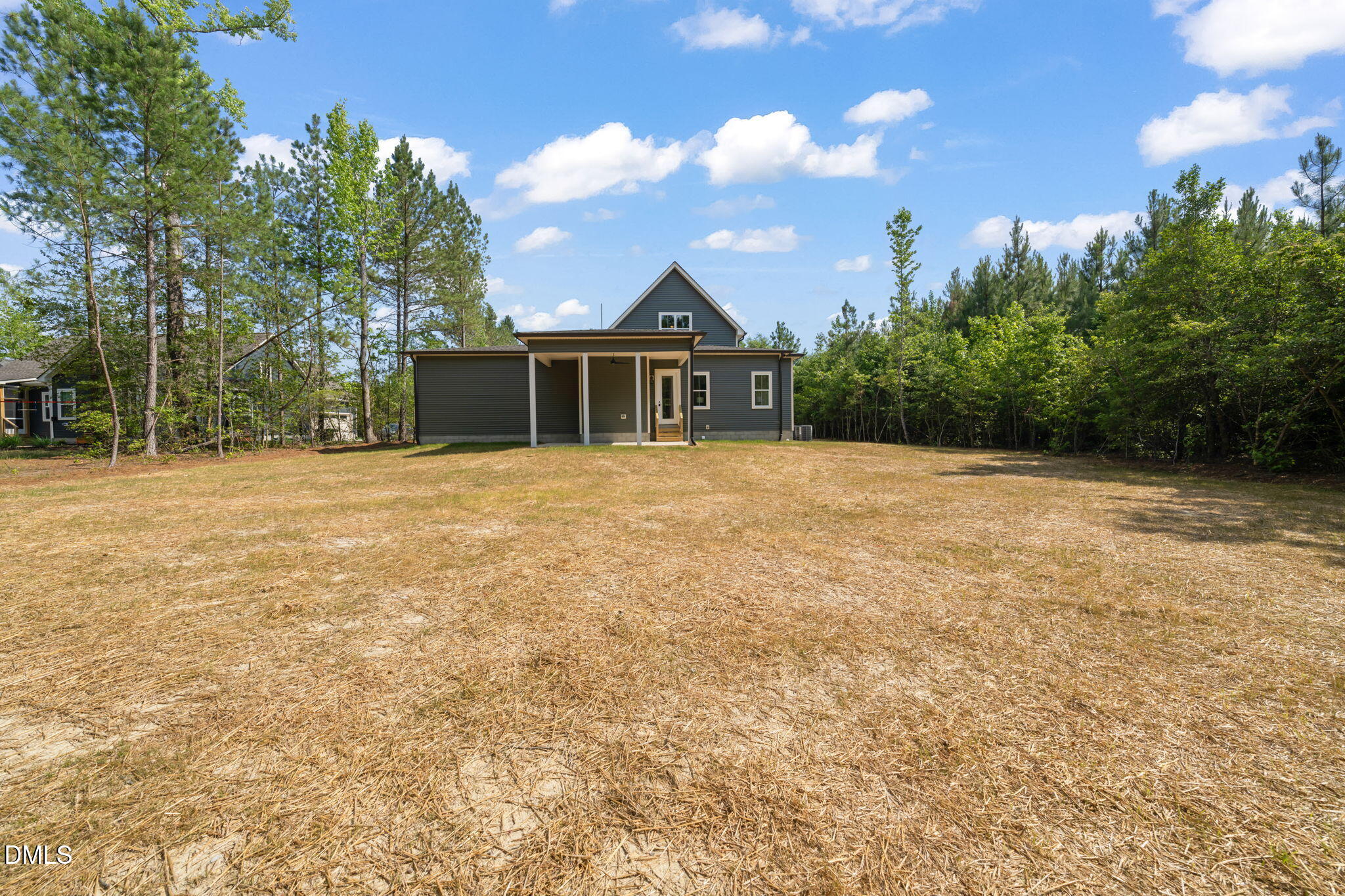 400 Pilot Ridge Road Zebulon, NC 27597 - Photo 48 of 51 a front view of a house with a yard and trees
