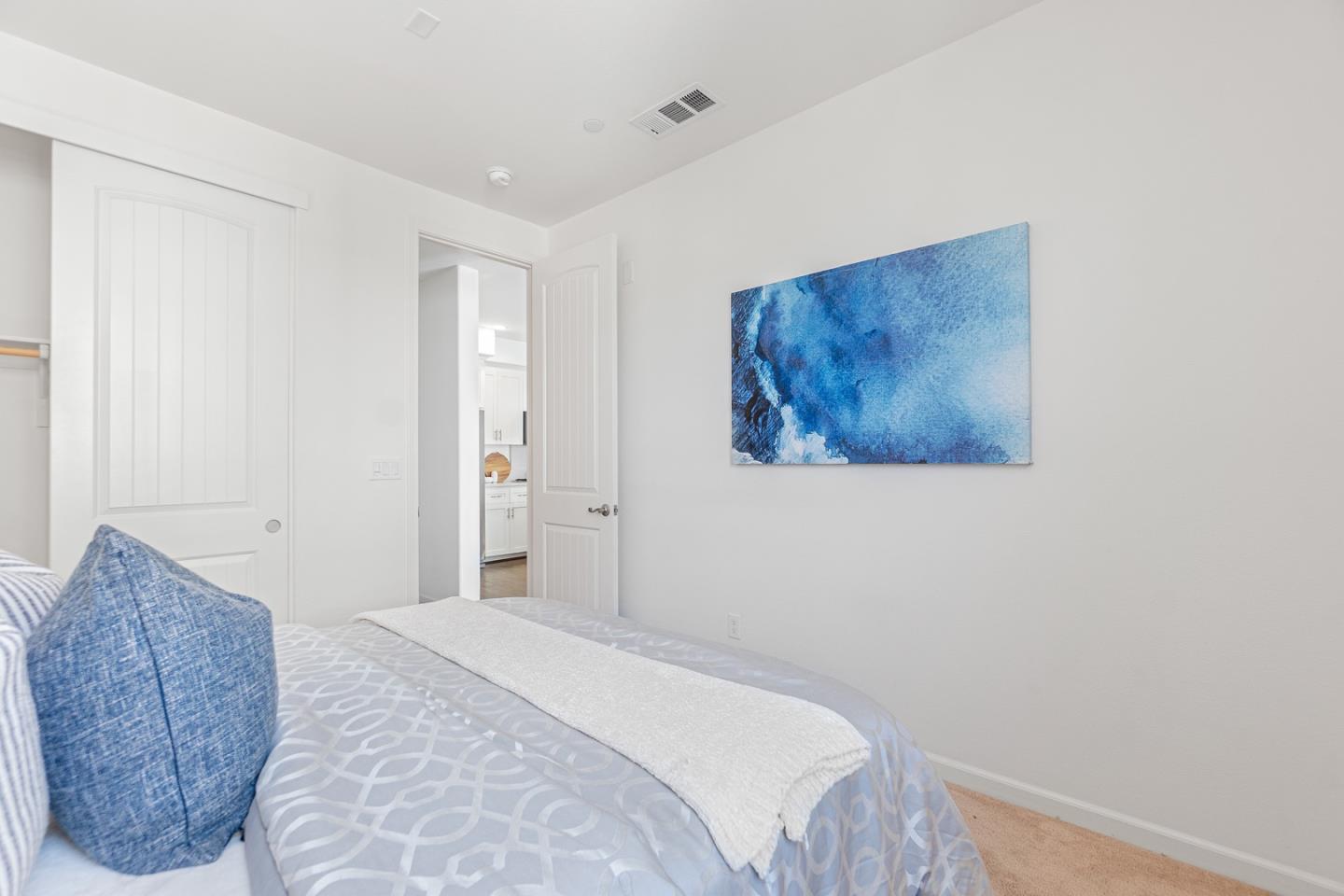 1926 Trento Loop Milpitas, CA 95035 - Photo 13 of 43 a bedroom with a bed and a painting