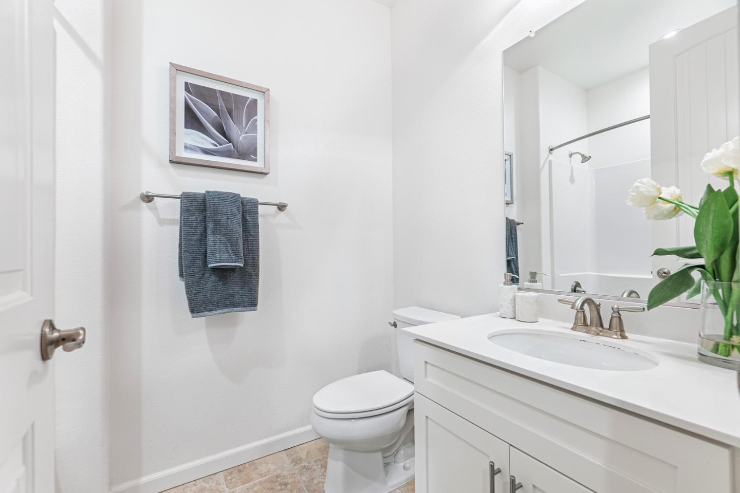 1926 Trento Loop Milpitas, CA 95035 - Photo 14 of 43 a bathroom with a toilet sink and mirror