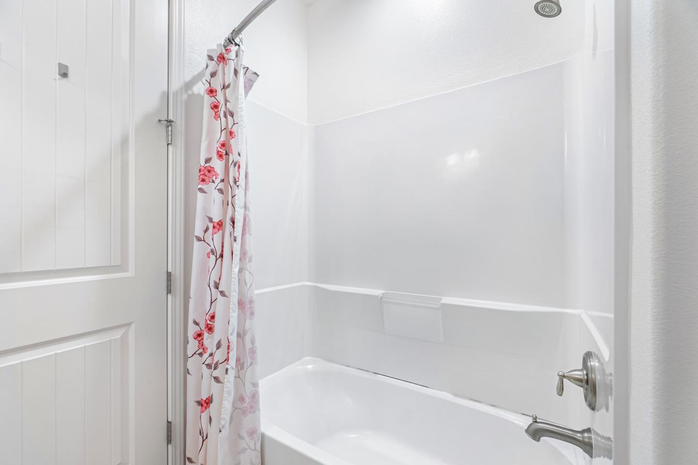 1926 Trento Loop Milpitas, CA 95035 - Photo 15 of 43 a bathroom with a bathtub and shower curtain