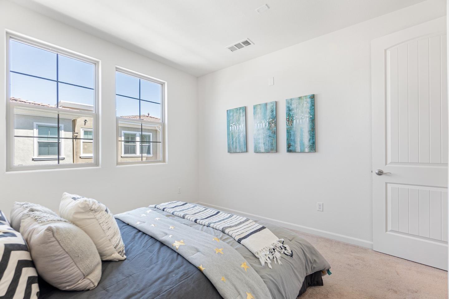 1926 Trento Loop Milpitas, CA 95035 - Photo 17 of 43 a bedroom with a bed and wooden floor