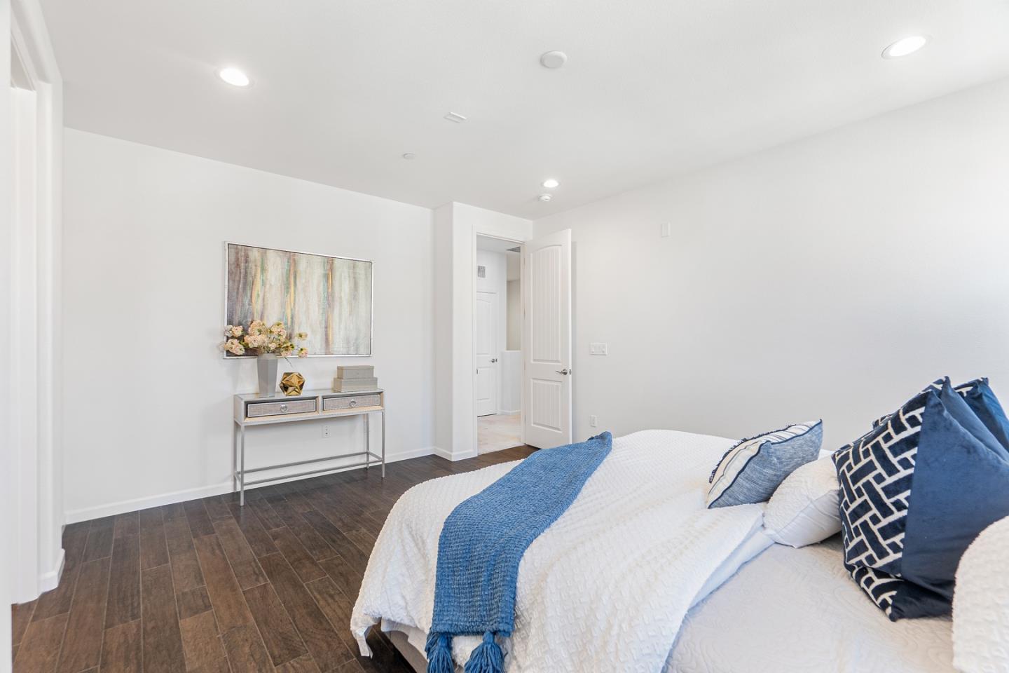 1926 Trento Loop Milpitas, CA 95035 - Photo 19 of 43 a bedroom with a bed and a table