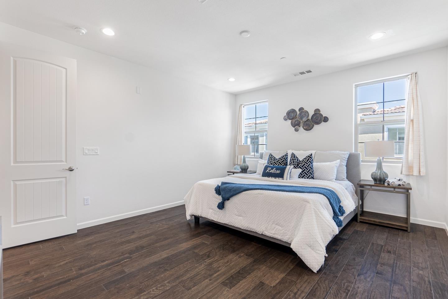 1926 Trento Loop Milpitas, CA 95035 - Photo 20 of 43 a bedroom with a bed and a painting