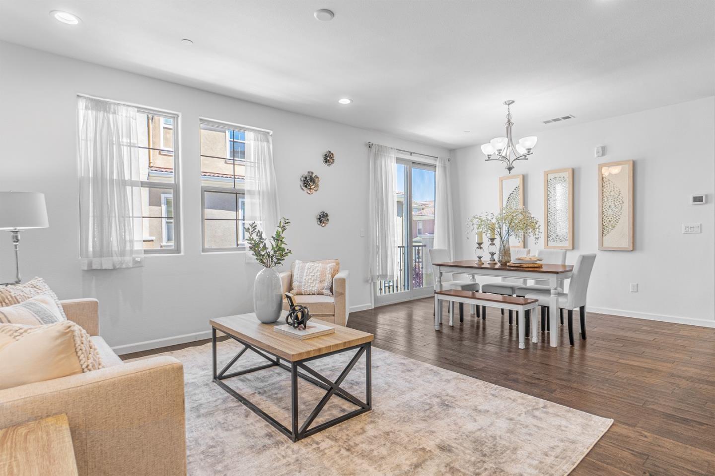 1926 Trento Loop Milpitas, CA 95035 - Photo 2 of 43 a living room with furniture a table and wooden floor