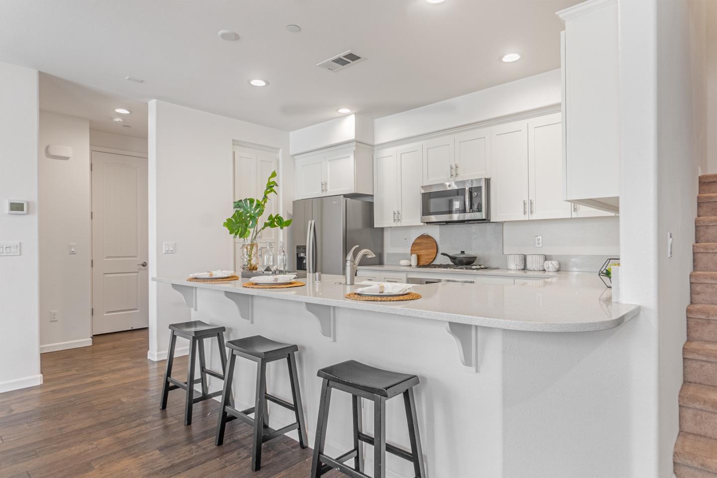 1926 Trento Loop Milpitas, CA 95035 - Photo 8 of 43 a kitchen with appliances a sink and cabinets