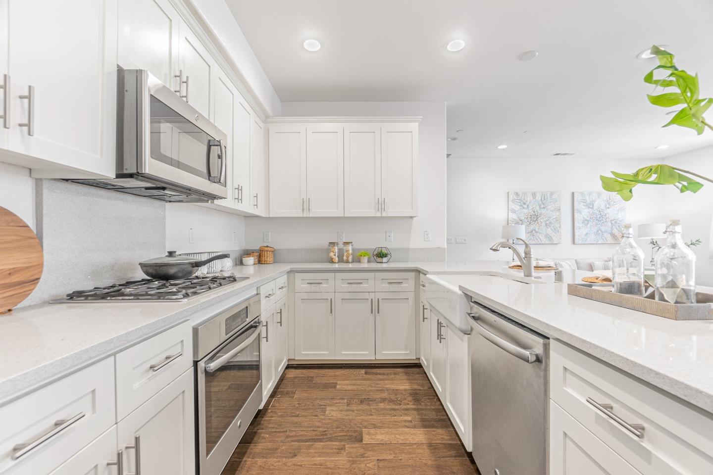 1926 Trento Loop Milpitas, CA 95035 - Photo 9 of 43 a kitchen with stainless steel appliances granite countertop a sink and stove top oven
