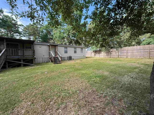 a view of a backyard with a garden