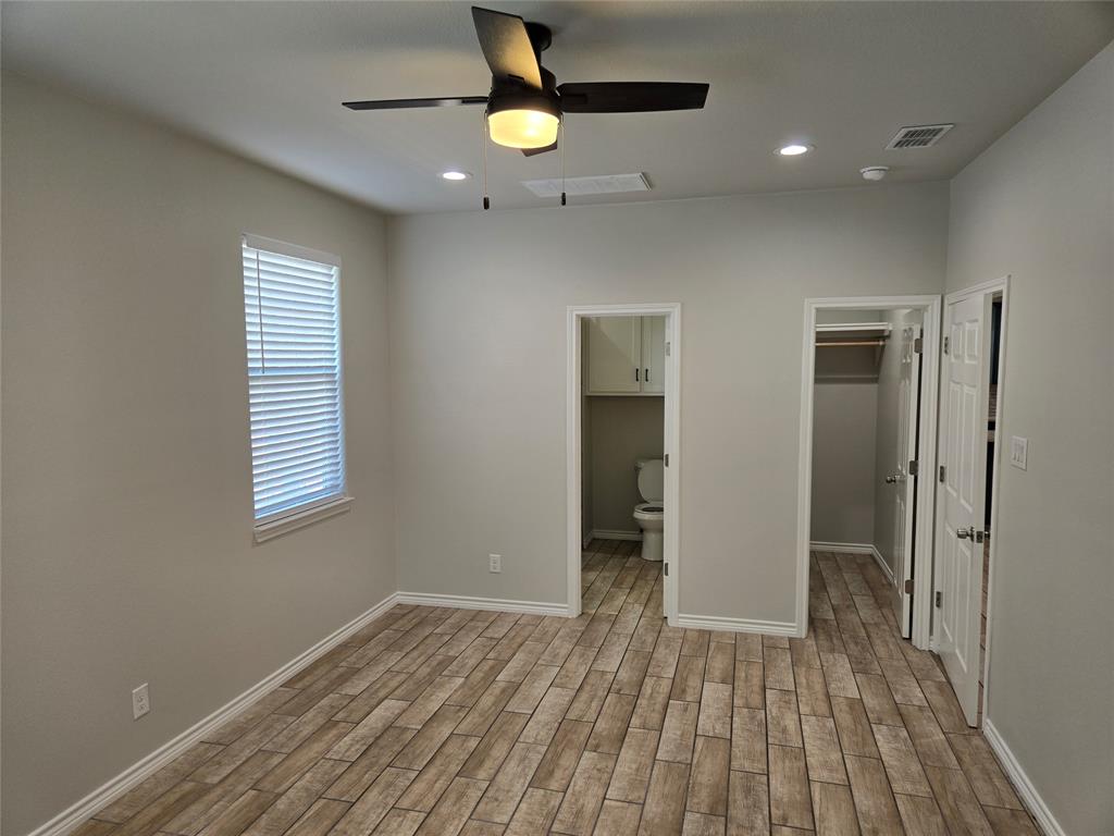 3704 Canyon Road Granbury, TX 76049 - Photo 12 of 30 wooden floor in an empty room with a window