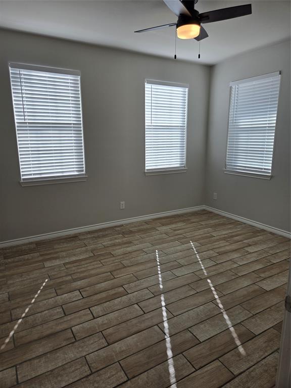 3704 Canyon Road Granbury, TX 76049 - Photo 18 of 30 a view of an empty room with a window
