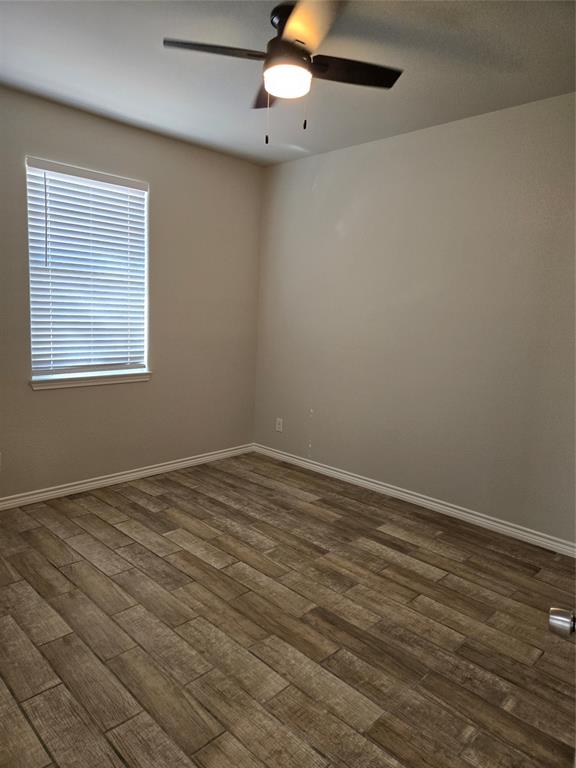3704 Canyon Road Granbury, TX 76049 - Photo 23 of 30 an empty room with a window and ceiling fan