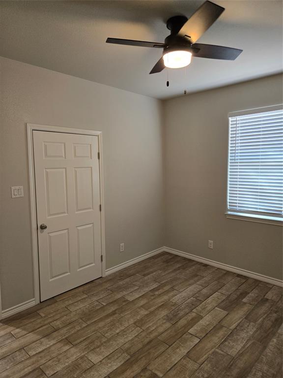 3704 Canyon Road Granbury, TX 76049 - Photo 24 of 30 a view of an empty room with wooden floor
