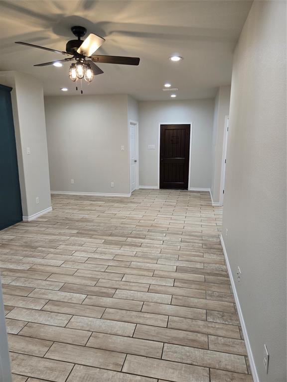 3704 Canyon Road Granbury, TX 76049 - Photo 4 of 30 a view of an empty room and chandelier fan