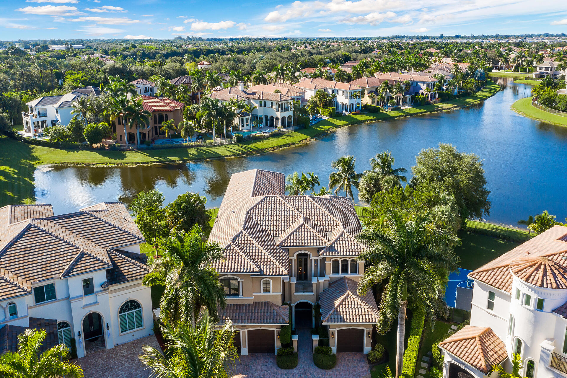 17895 Cadena Drive Boca Raton, FL 33496 - Photo 5 of 68 an aerial view of residential houses with outdoor space and lake view