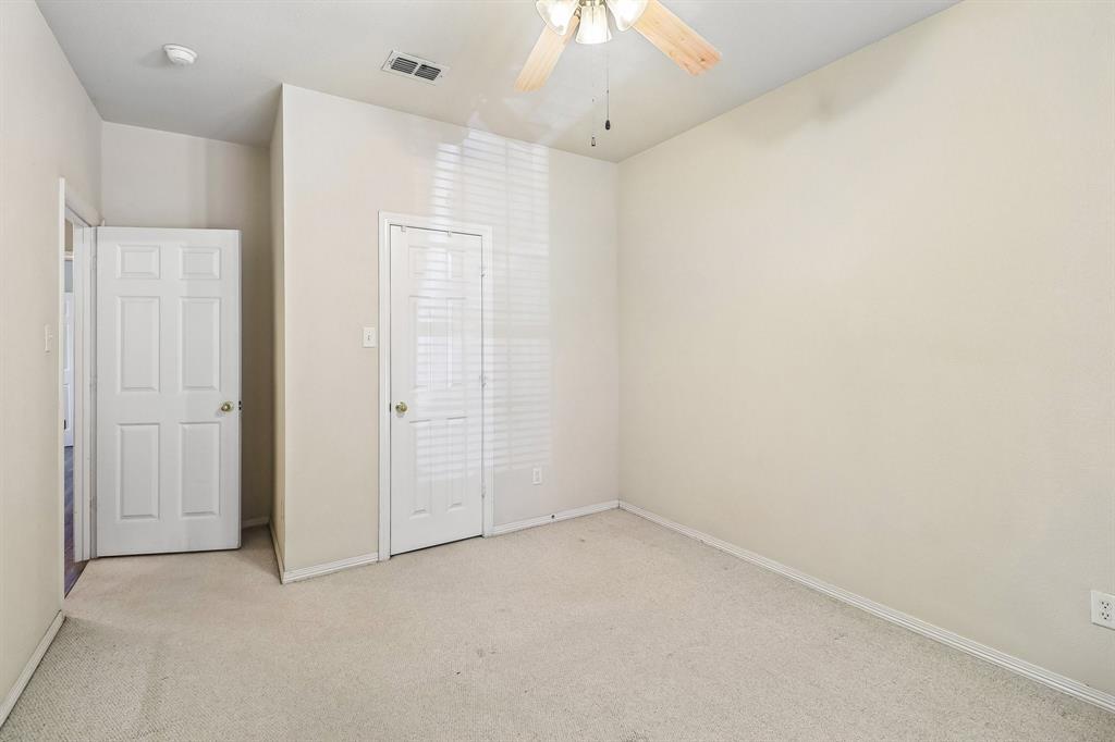 5609 Saddleback Road Arlington, TX 76017 - Photo 18 of 23 an empty room with a empty space and a ceiling fan